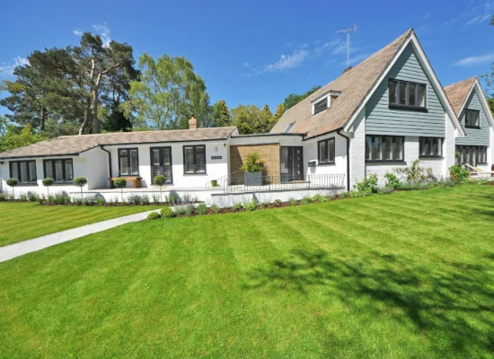 Fresh green lawn outside home protected through residential pest control services