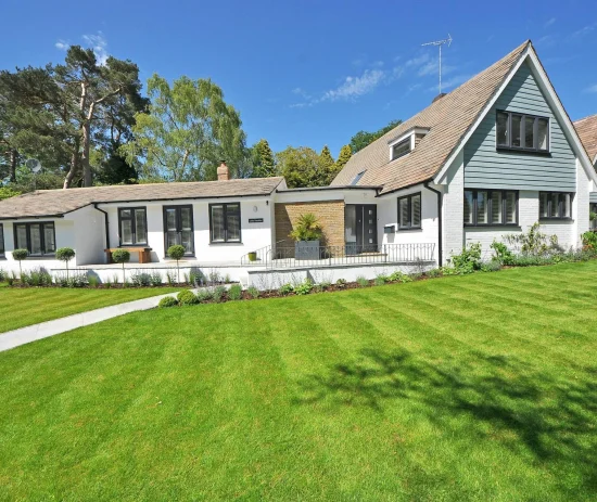 Fresh green lawn outside home protected through residential pest control services